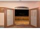 The patio has arched double doors leading inside with view of neighborhood at night at 2279 Fieldstone Dr, Conyers, GA 30013
