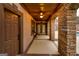 Covered patio with stone archways, brick accents, and ceiling fans for comfortable outdoor living at 2279 Fieldstone Dr, Conyers, GA 30013