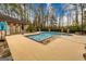 In-ground pool with an attached spa and outdoor entertaining space, and fenced-in yard at 2279 Fieldstone Dr, Conyers, GA 30013