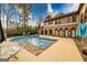 Beautiful in-ground pool with attached spa with access to the home's multiple entry points at 2279 Fieldstone Dr, Conyers, GA 30013