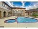 Beautiful in-ground pool with an attached spa and outdoor entertaining space at 2279 Fieldstone Dr, Conyers, GA 30013