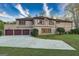 Spacious home with three-car garage and large concrete drive perfect for parking at 2279 Fieldstone Dr, Conyers, GA 30013