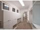 Bright walk-in closet featuring custom cabinets, drawers, and stained glass windows for natural light at 2279 Fieldstone Dr, Conyers, GA 30013