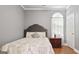 Inviting bedroom with a serene ambiance, hardwood floors, and ample natural light creating a cozy retreat at 131 Pecan Lake Dr, Sharpsburg, GA 30277