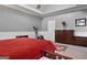 Well-lit bedroom with ample space, neutral walls, and a mix of modern and classic furniture at 131 Pecan Lake Dr, Sharpsburg, GA 30277