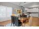 Cozy dining area with views into the kitchen, adjacent to the living area at 131 Pecan Lake Dr, Sharpsburg, GA 30277