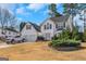 Charming two-story home with a well-maintained front yard and attached two-car garage at 1191 Berryhill Dr, Lithonia, GA 30058