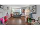 Bright living room featuring hardwood floors, neutral paint, and a large window at 1191 Berryhill Dr, Lithonia, GA 30058