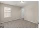 Neutral bedroom featuring carpet, one window with blind, and an interior door at 1064 Lear Dr, Locust Grove, GA 30248