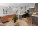 Open concept kitchen and dining area featuring granite countertops and modern appliances at 1064 Lear Dr, Locust Grove, GA 30248