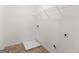 Bright laundry room with vinyl flooring and wire shelving ready for use at 1064 Lear Dr, Locust Grove, GA 30248