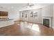 Open living area with hardwood floors, a fireplace, and lots of natural light at 1064 Lear Dr, Locust Grove, GA 30248