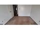 Neutral bedroom features a standard closet and a window for natural light at 4812 White Oak Path, Stone Mountain, GA 30088
