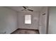 Standard bedroom featuring a ceiling fan and a window providing natural light at 4812 White Oak Path, Stone Mountain, GA 30088