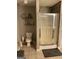 Cozy bathroom featuring a toilet and shower with mosaic tile accents, showcasing a clean and functional design at 2626 Summit Sw Pkwy, Atlanta, GA 30331