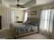 Comfortable bedroom featuring large windows, a ceiling fan, and a plush bed at 2626 Summit Sw Pkwy, Atlanta, GA 30331