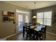 Cozy dining area with a dark wood table, seating for six, and access to the outdoor deck at 2626 Summit Sw Pkwy, Atlanta, GA 30331