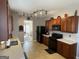 Spacious kitchen featuring wood cabinets, modern appliances, and a view of the adjoining living room at 2626 Summit Sw Pkwy, Atlanta, GA 30331