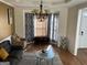Bright living room featuring hardwood floors, large windows, and stylish curtains at 2626 Summit Sw Pkwy, Atlanta, GA 30331