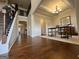 Inviting foyer with hardwood floors, staircase, and views into other rooms of the home at 101 Elkins Blvd # 53, Locust Grove, GA 30248