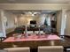 Open concept living room and dining area with coffered ceiling, fireplace, and modern decor at 101 Elkins Blvd # 53, Locust Grove, GA 30248