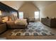 Bright main bedroom boasts a neutral color palette, accent wall, and ample space for relaxing at 101 Elkins Blvd # 53, Locust Grove, GA 30248