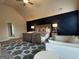 Spacious main bedroom features a dark accent wall, cozy rug, and sitting area at 101 Elkins Blvd # 53, Locust Grove, GA 30248