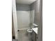 Bathroom with a tiled shower, vanity, and toilet, offering a clean and functional space at 8547 Jamestown Way, Jonesboro, GA 30238