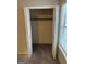A closet with bi-fold doors and a rod for hanging clothes, providing practical storage space at 8547 Jamestown Way, Jonesboro, GA 30238