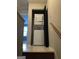Stackable washer and dryer on tiled floor; great space saving setup at 8547 Jamestown Way, Jonesboro, GA 30238