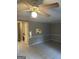 Living room with tile flooring and a view into the kitchen, providing an open and connected living space at 8547 Jamestown Way, Jonesboro, GA 30238