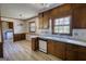 Eat-in kitchen features wood cabinets, neutral countertops, a double basin sink and vintage appliances at 1295 Maple St Se, Conyers, GA 30013