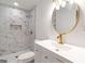 Modern bathroom featuring tiled shower, a sleek vanity, and gold-tone fixtures at 1894 Evans Evans Sw Dr, Atlanta, GA 30310