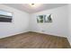 Bedroom features hardwood floors and multiple windows for natural light at 1894 Evans Evans Sw Dr, Atlanta, GA 30310