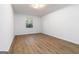 Minimalist bedroom with wood floor and a window that brings in ample natural light at 1894 Evans Evans Sw Dr, Atlanta, GA 30310