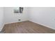 Bright bedroom features hardwood floors and a window with natural light at 1894 Evans Evans Sw Dr, Atlanta, GA 30310