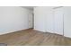 Spacious bedroom features wood-look flooring and large closet at 1894 Evans Evans Sw Dr, Atlanta, GA 30310