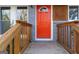 Inviting orange front door and well-maintained wooden porch with modern architectural details at 1894 Evans Evans Sw Dr, Atlanta, GA 30310