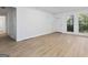 Bright living room featuring sleek wood flooring, modern fixtures, and ample natural light at 1894 Evans Evans Sw Dr, Atlanta, GA 30310