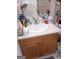 Bathroom features an undermount sink with cabinets, neutral countertop, and faucet at 7236 Georges Way, Morrow, GA 30260