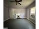 Cozy bedroom with a decorative fireplace and natural light from the window at 45 Poplar St, Porterdale, GA 30014