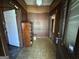 Traditional entryway featuring wood paneled walls and a vintage cabinet at 45 Poplar St, Porterdale, GA 30014