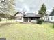 Charming home featuring a cozy screened porch and traditional architectural details at 45 Poplar St, Porterdale, GA 30014