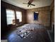 Hardwood living room with wood-paneled walls and two large windows at 45 Poplar St, Porterdale, GA 30014