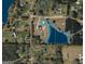 See the surrounding area and expansive property lines from this aerial view of the estate and pond at 105 Coogler Way, Brooks, GA 30205