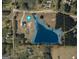 See the surrounding area and expansive property lines from this aerial view of the estate and pond at 105 Coogler Way, Brooks, GA 30205