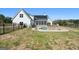 Large grassy backyard with in-ground pool and covered patio area at 105 Coogler Way, Brooks, GA 30205