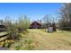 A view of the barn and sheds on the property at 105 Coogler Way, Brooks, GA 30205