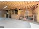 Barn interior featuring horse stalls with hay and gates, great for equestrian enthusiasts at 105 Coogler Way, Brooks, GA 30205
