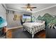 Cozy bedroom with modern ceiling fan, wall decor, and comfortable bed. Perfect for relaxation at 105 Coogler Way, Brooks, GA 30205